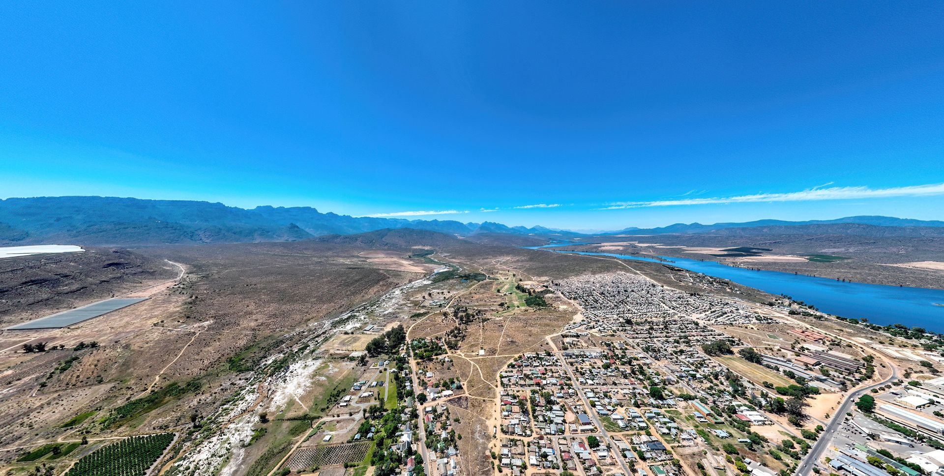 Citrusdal from the air at dusk, the Olifants River running along the far edge of the valley below the Cederberg